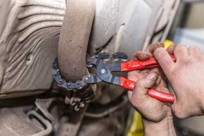 man changing an exhaust
